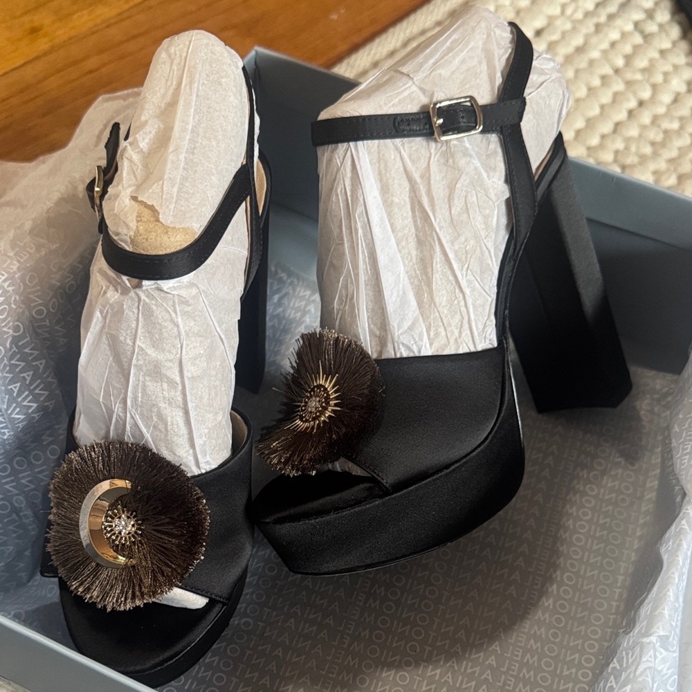 ANTONIO MELANI Helene Celestial Black & Gold Platform Heels with Brown Pom Pom